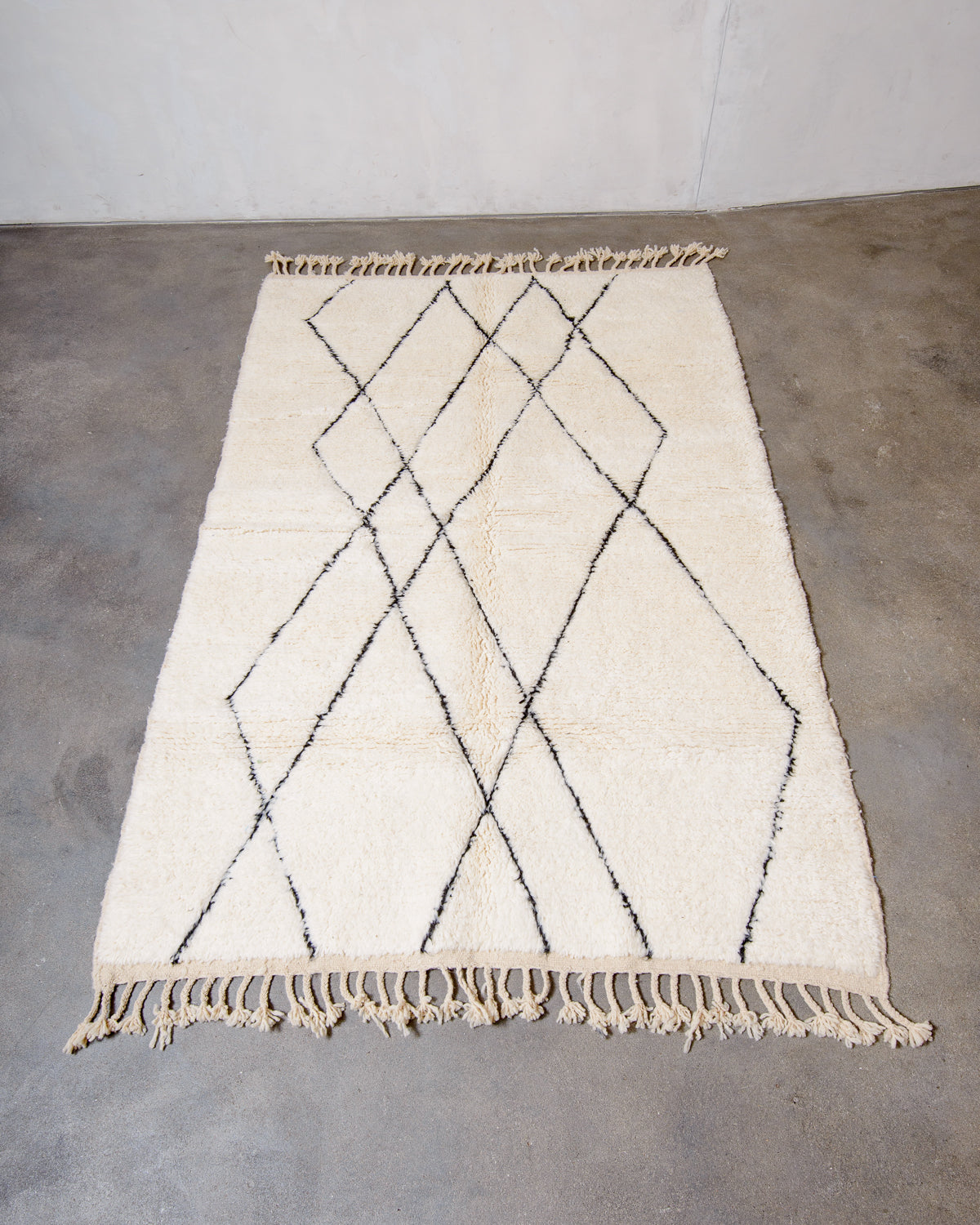 Modern, designer, handcrafted Berber rug from Morocco. Beniourain carpet with minimalist design, natural wool pile and a fluffy texture.